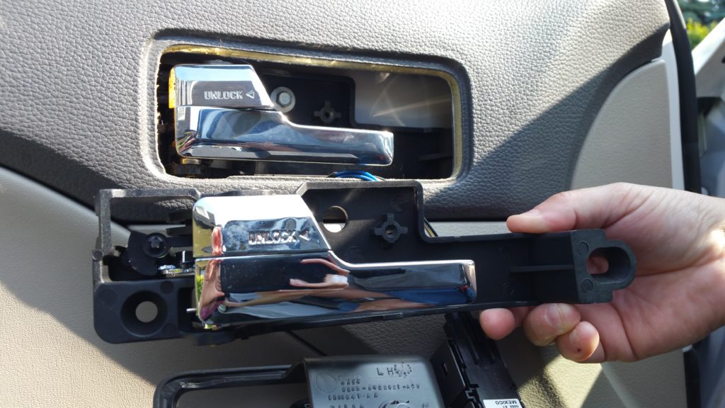 Comparing new door handle assembly to old