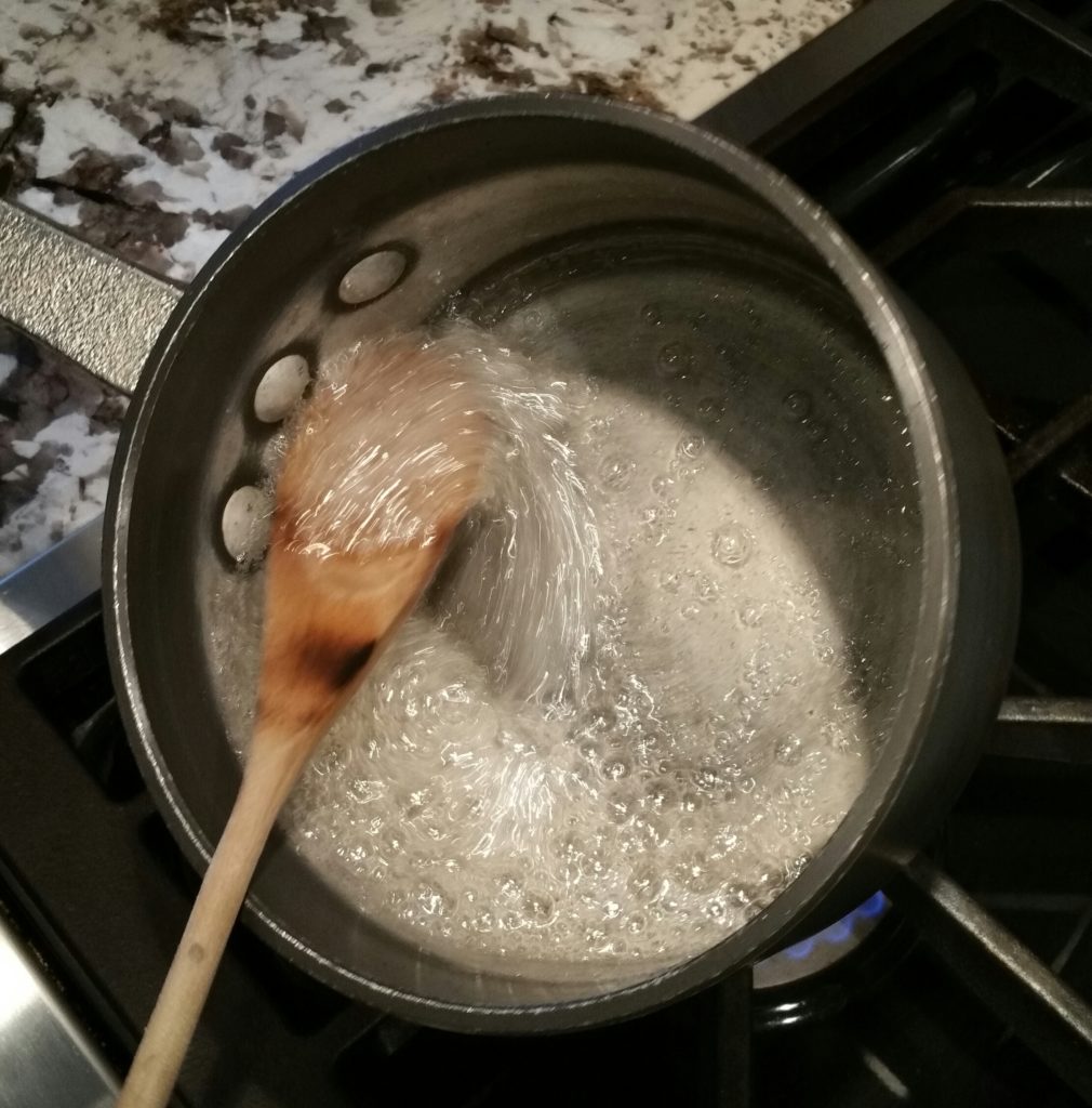 The sugar-water mixture is becoming syrup-like.
