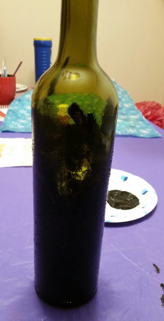 Starting to cover the bottle...